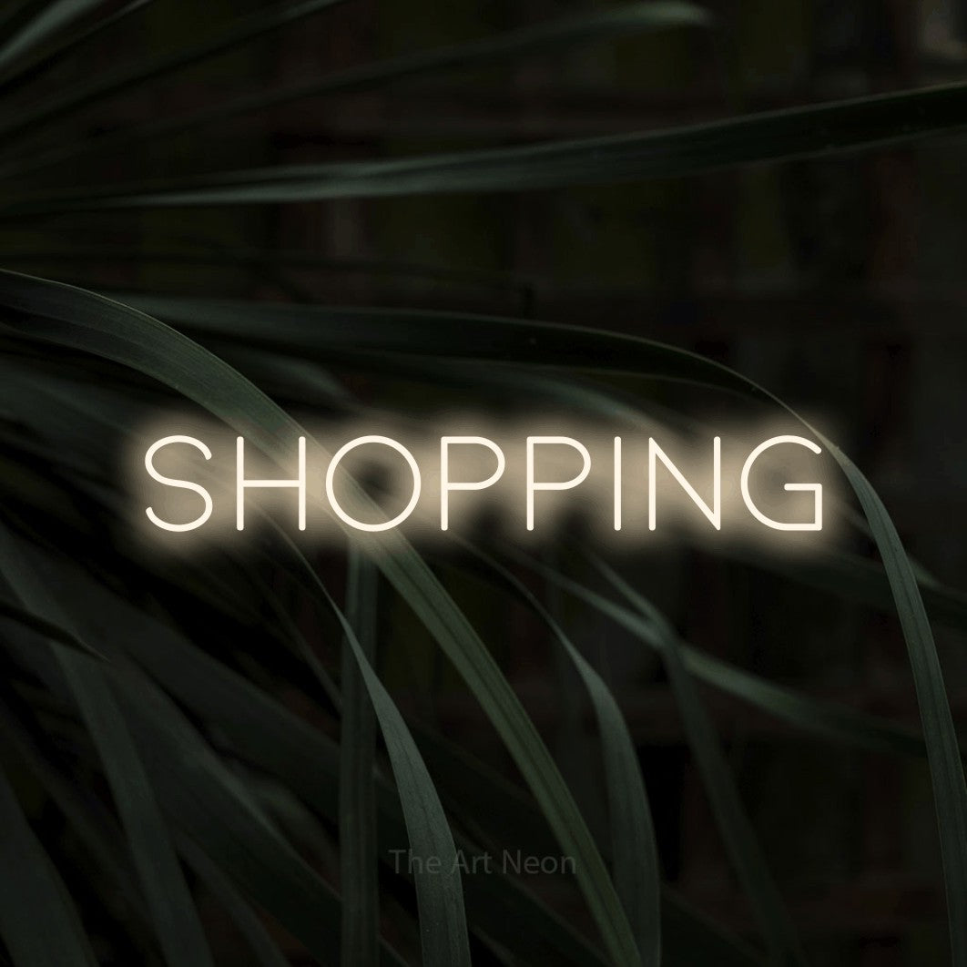 LED neon sign reading “SHOPPING”, arranged in a single line.