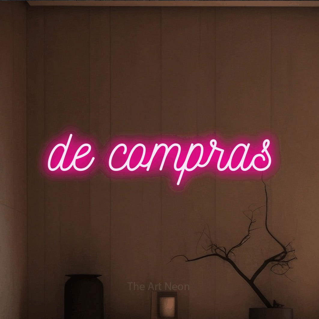 LED neon sign reading “de compras”, arranged in a single line.