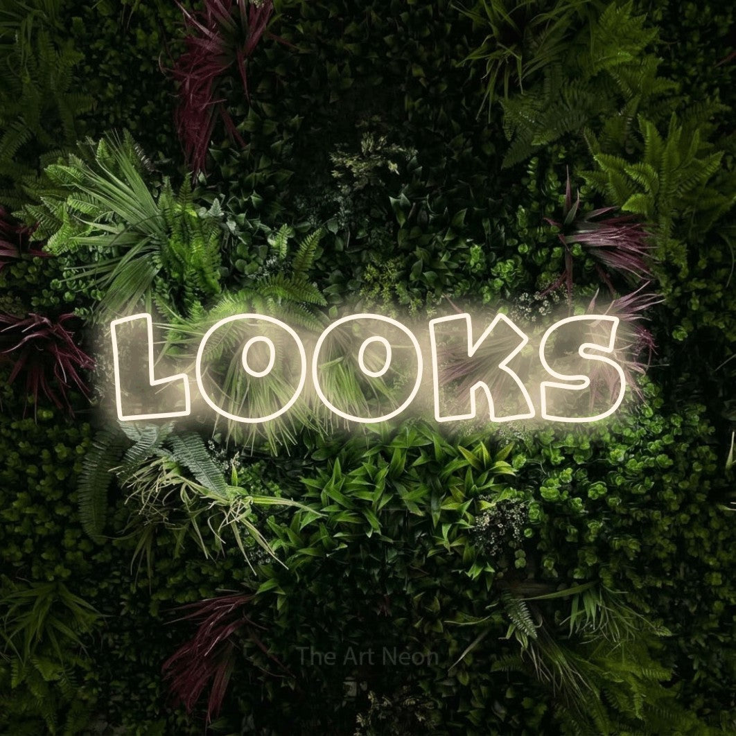 LED neon sign reading “looks”, arranged in a single line.