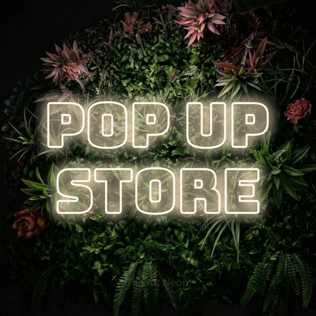 LED neon sign reading “POP UP STORE”, arranged in 2 lines.