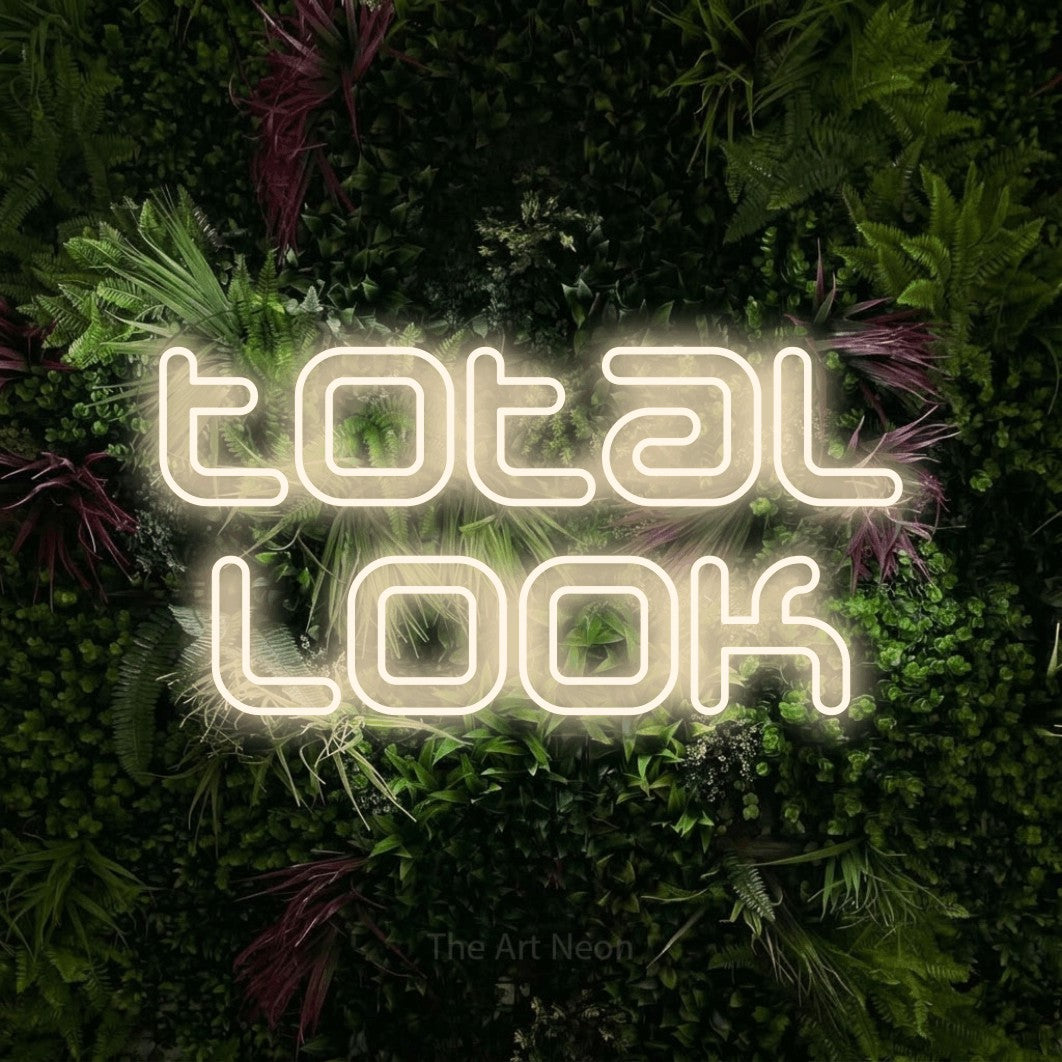 LED neon sign reading “total look”, arranged in 2 lines.