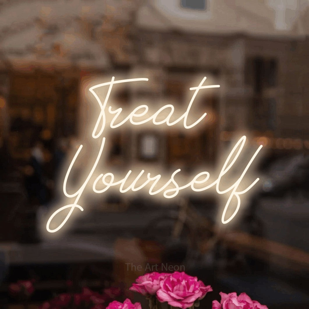LED neon sign reading “Treat Yourself”, arranged in 2 lines.