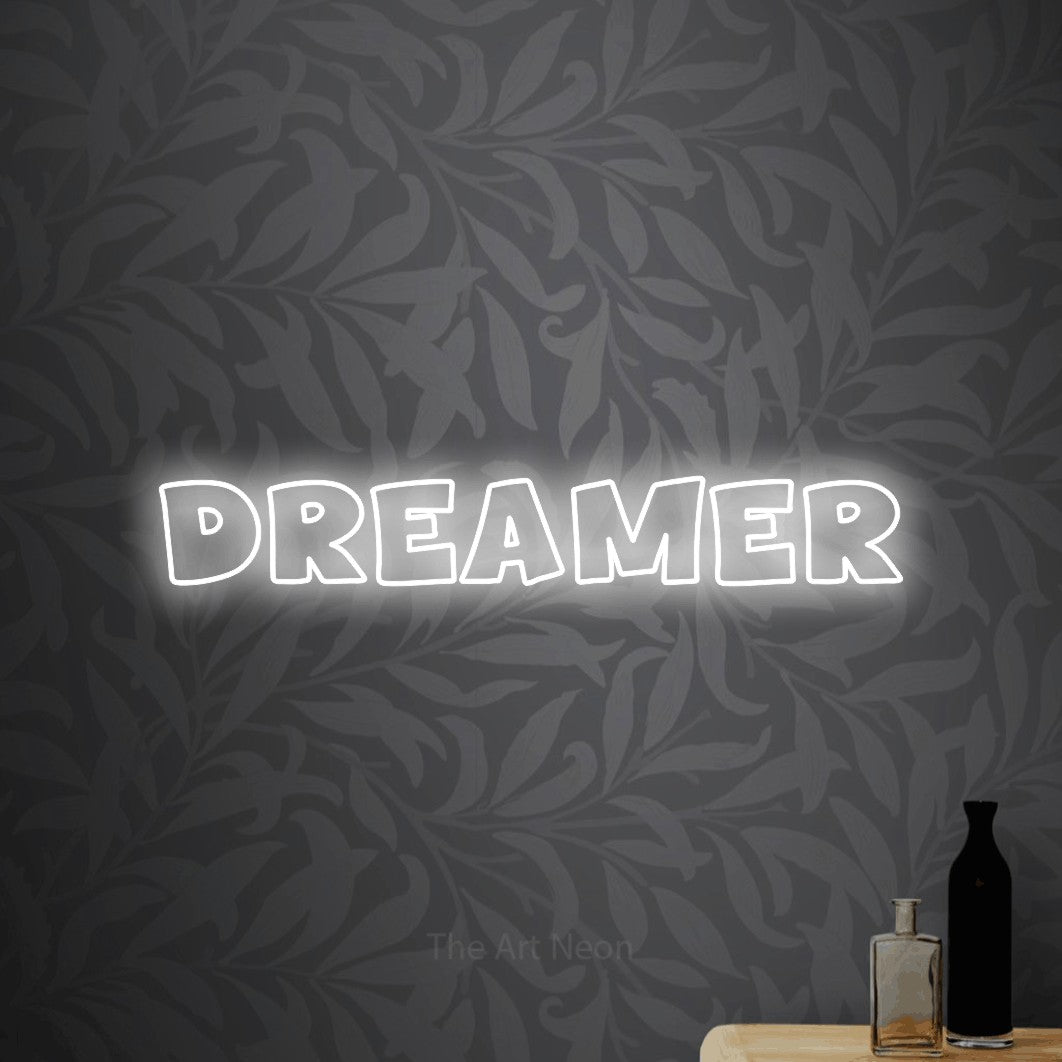 LED neon sign reading “DREAMER”, arranged in a single line.