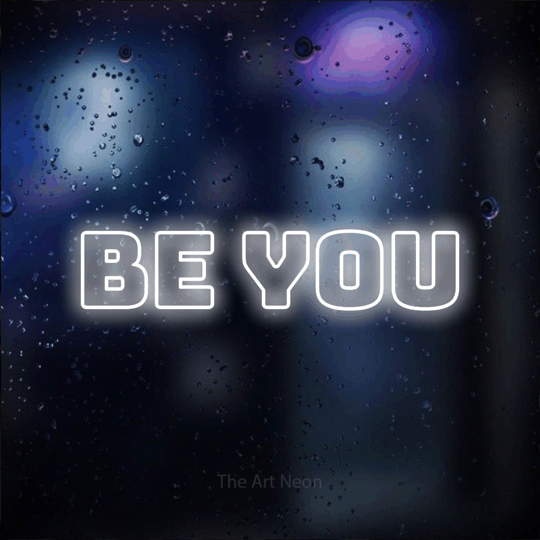 LED neon sign reading “BE YOU”, arranged in a single line.