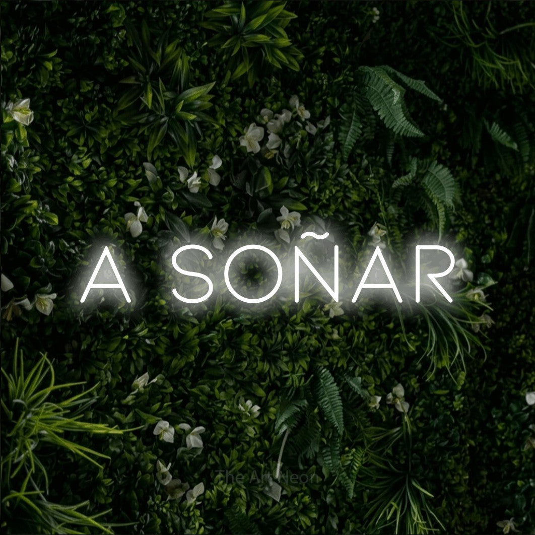 LED neon sign reading “A SOÑAR”, arranged in a single line.