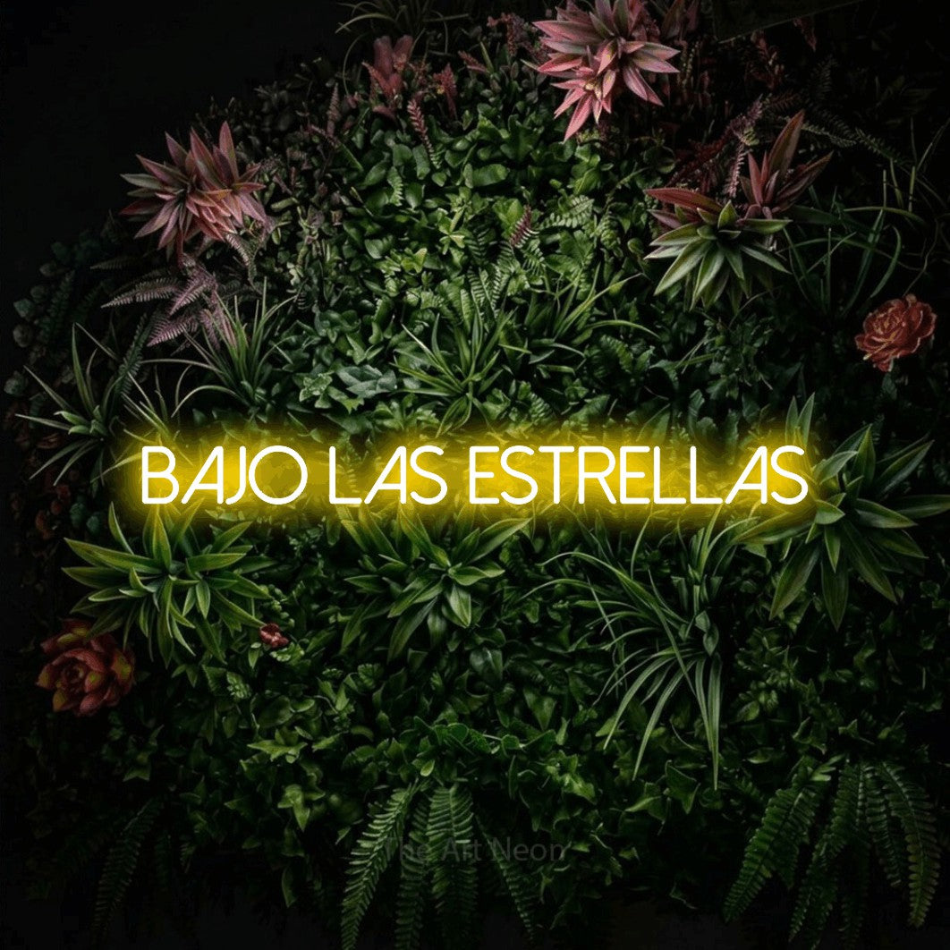LED neon sign reading “bajo las ESTRELLAS”, arranged in a single line.