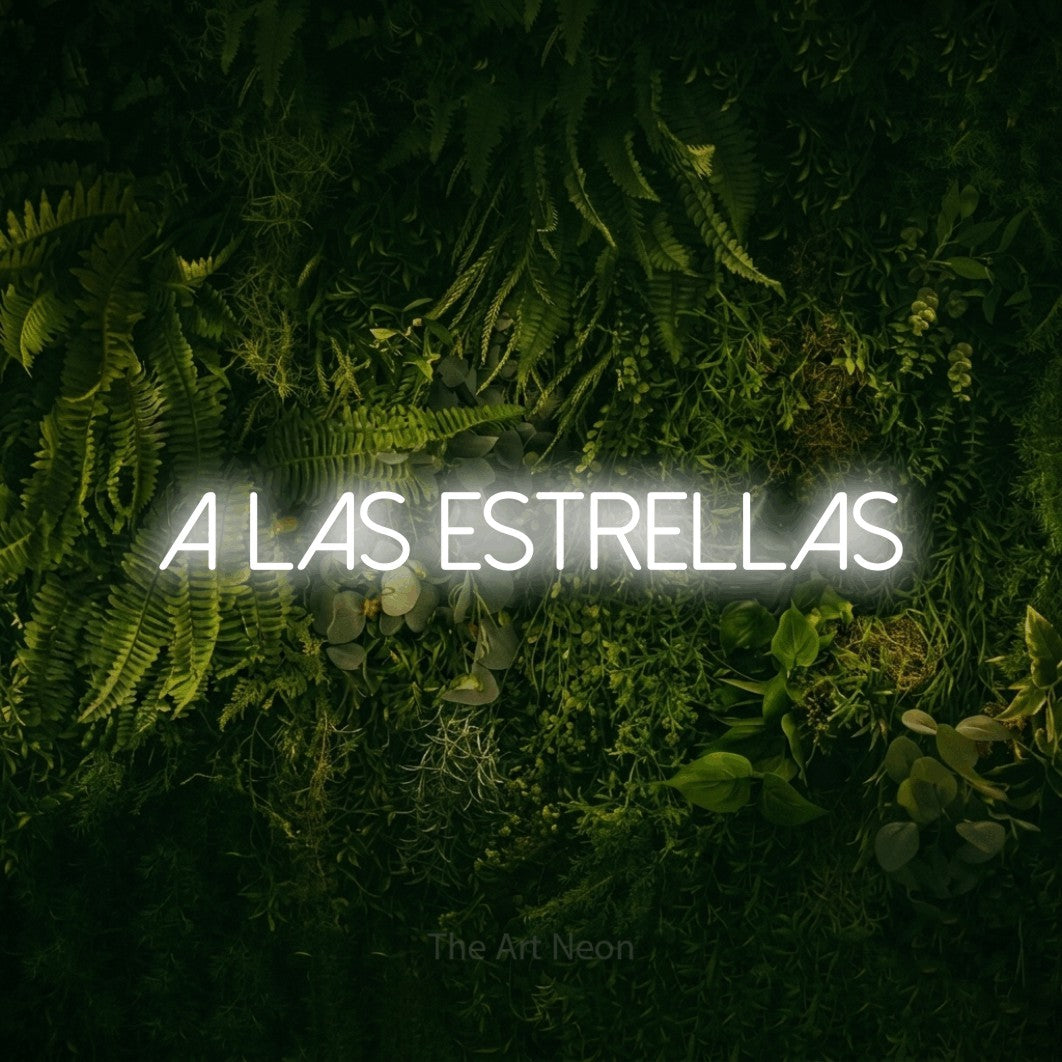 LED neon sign reading “a las estrellas”, arranged in a single line.