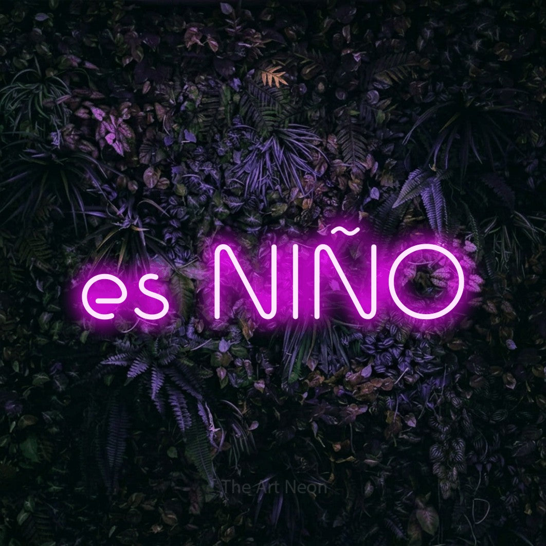 LED neon sign reading “es NIÑO”, arranged in a single line.