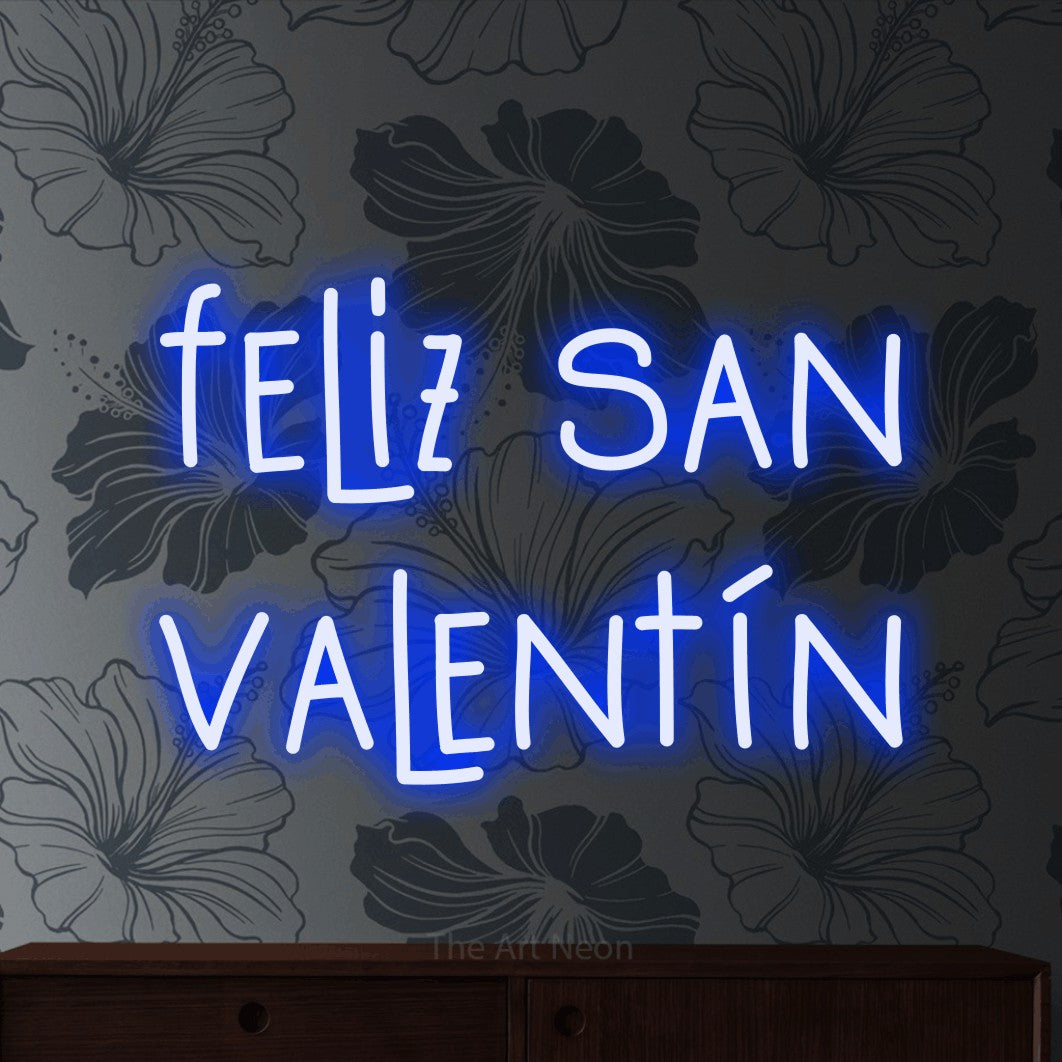 LED neon sign reading “feliz san valentín”, arranged in 2 lines.