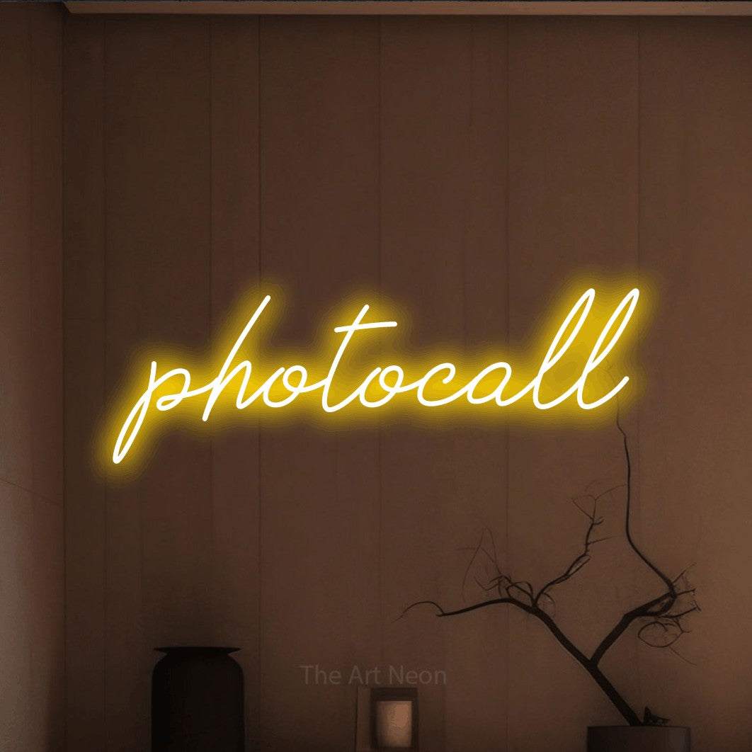 LED neon sign reading “photocall”, arranged in a single line.