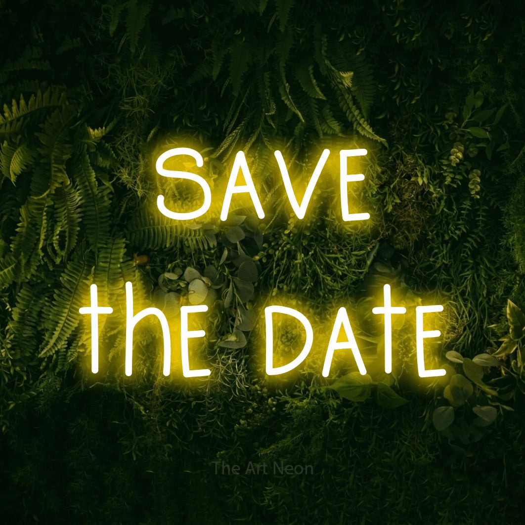 LED neon sign reading “save the date”, arranged in 2 lines.
