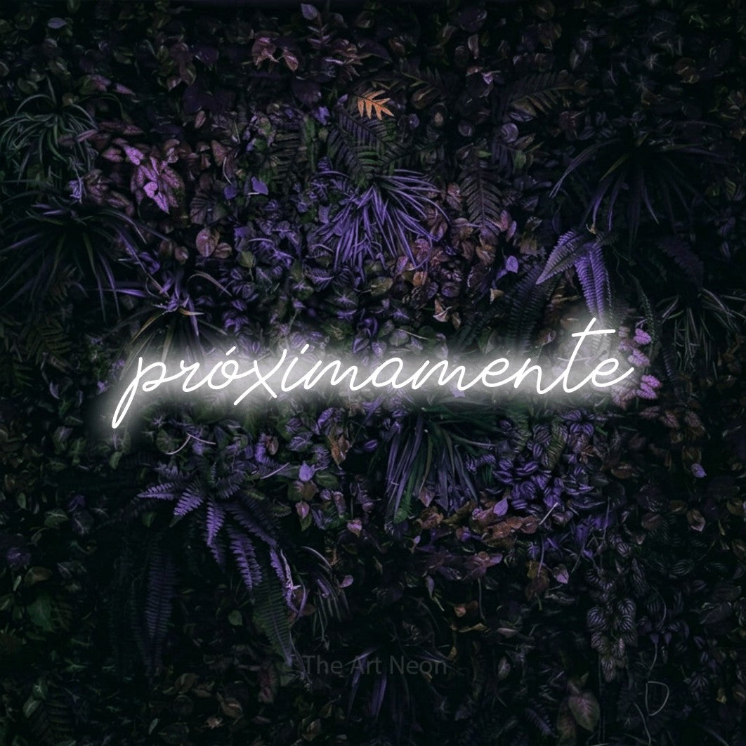 LED neon sign reading “próximamente”, arranged in a single line.