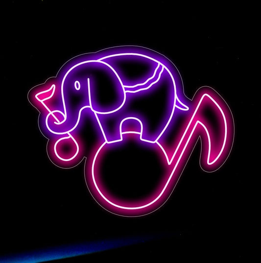 "Elephant Silhouette with Music Notes Neon Sign" harmoniously lights up, fusing majestic presence with rhythmic notes, perfect for music studios and cultural spaces.