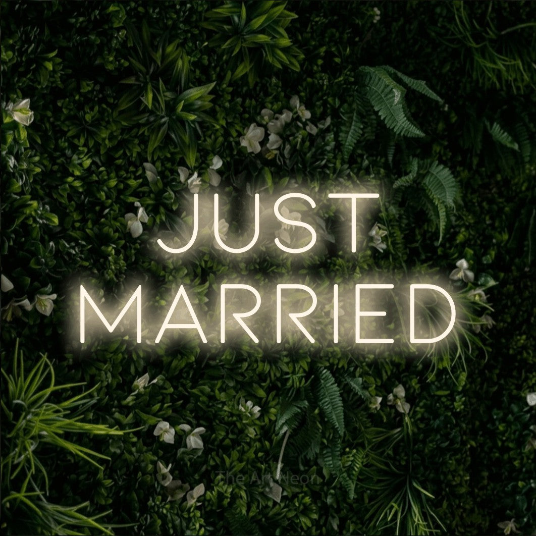LED neon sign reading “Just Married”, arranged in two lines.