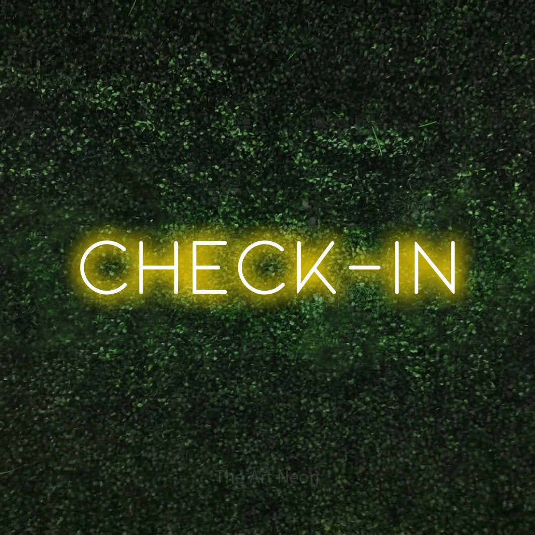 LED neon sign reading “CHECK-IN”, arranged in a single line.
