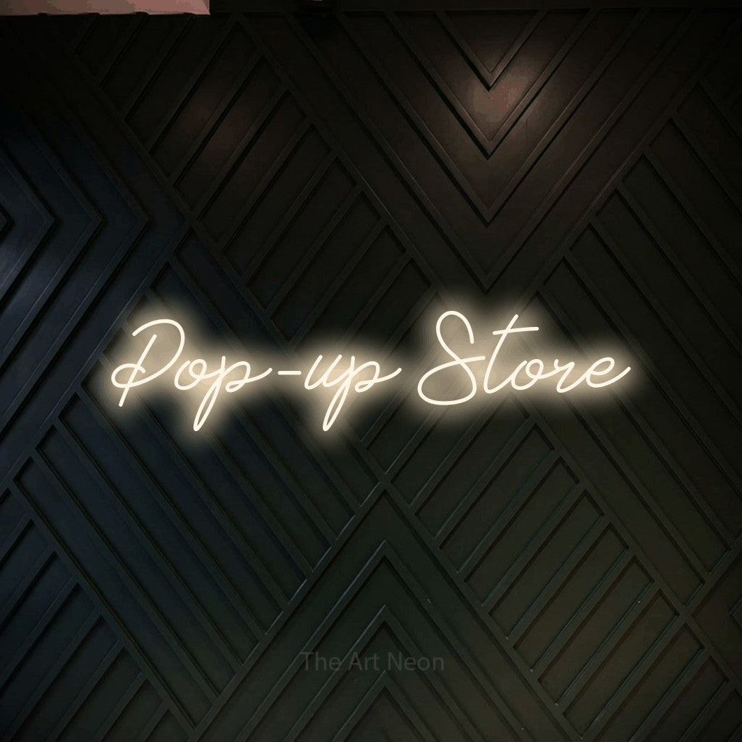 LED neon sign reading “Pop-up Store”, arranged in a single line.