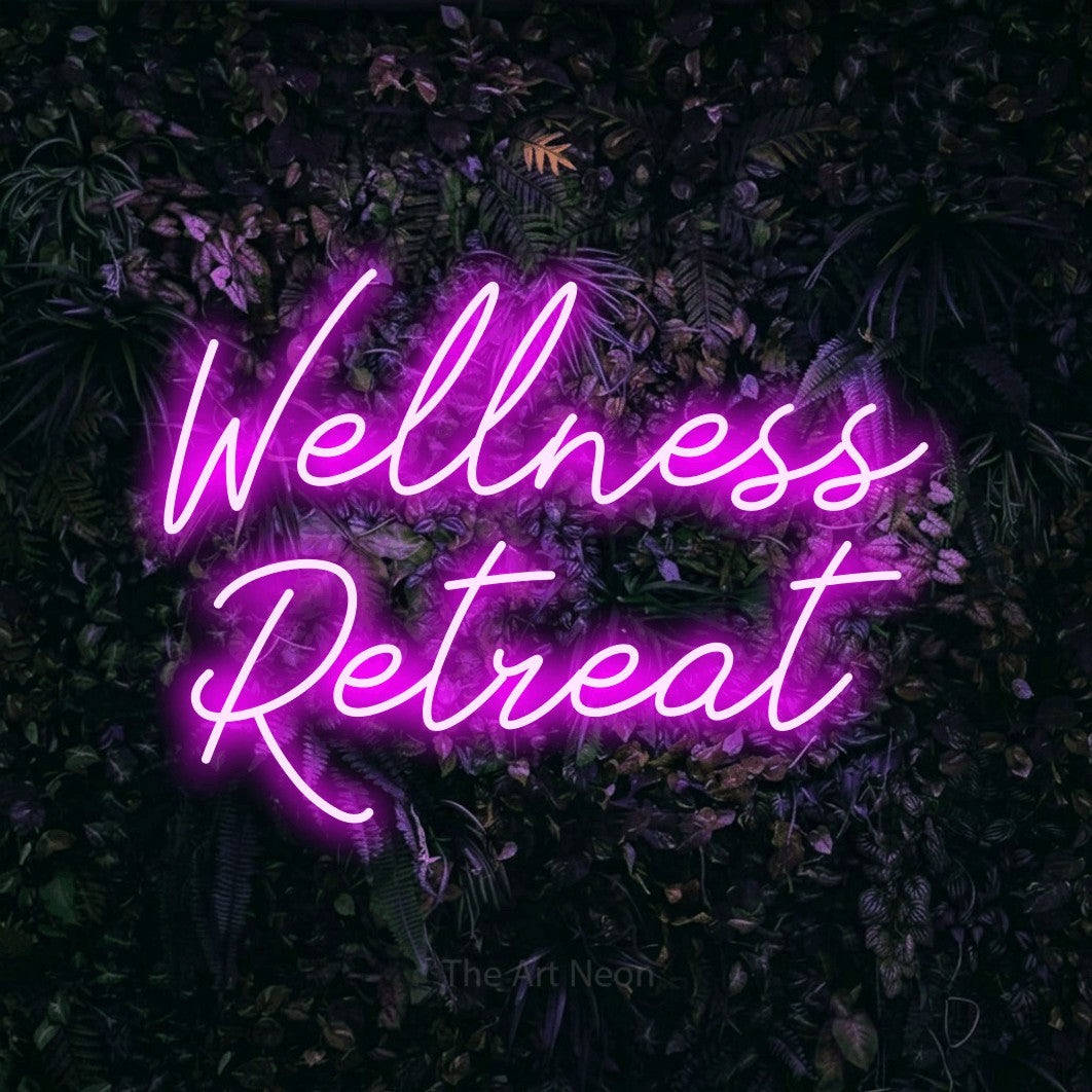 LED neon sign reading “Wellness Retreat”, arranged in two lines.