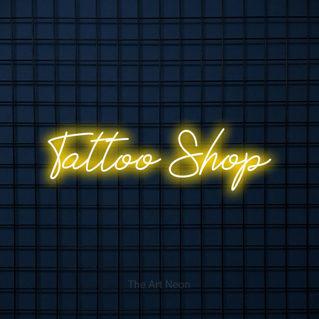 LED neon sign reading “Tattoo Shop”, arranged in a single line.
