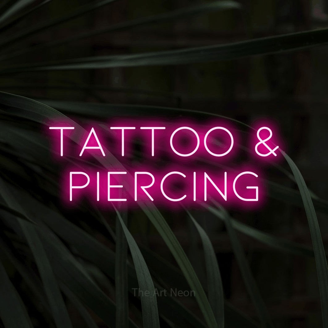 LED neon sign reading “TATTOO & PIERCING”, arranged in two lines.