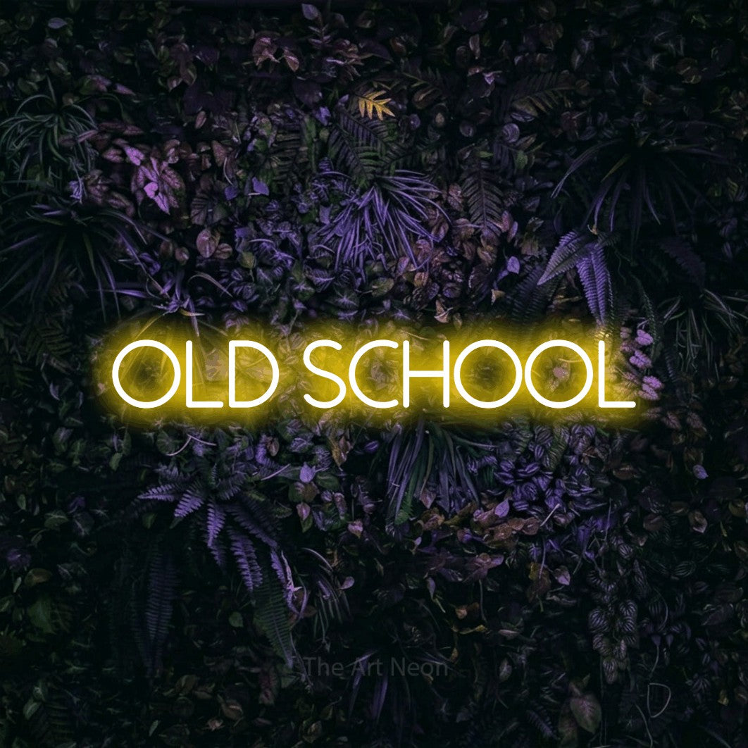 LED neon sign reading “old school”, arranged in a single line.