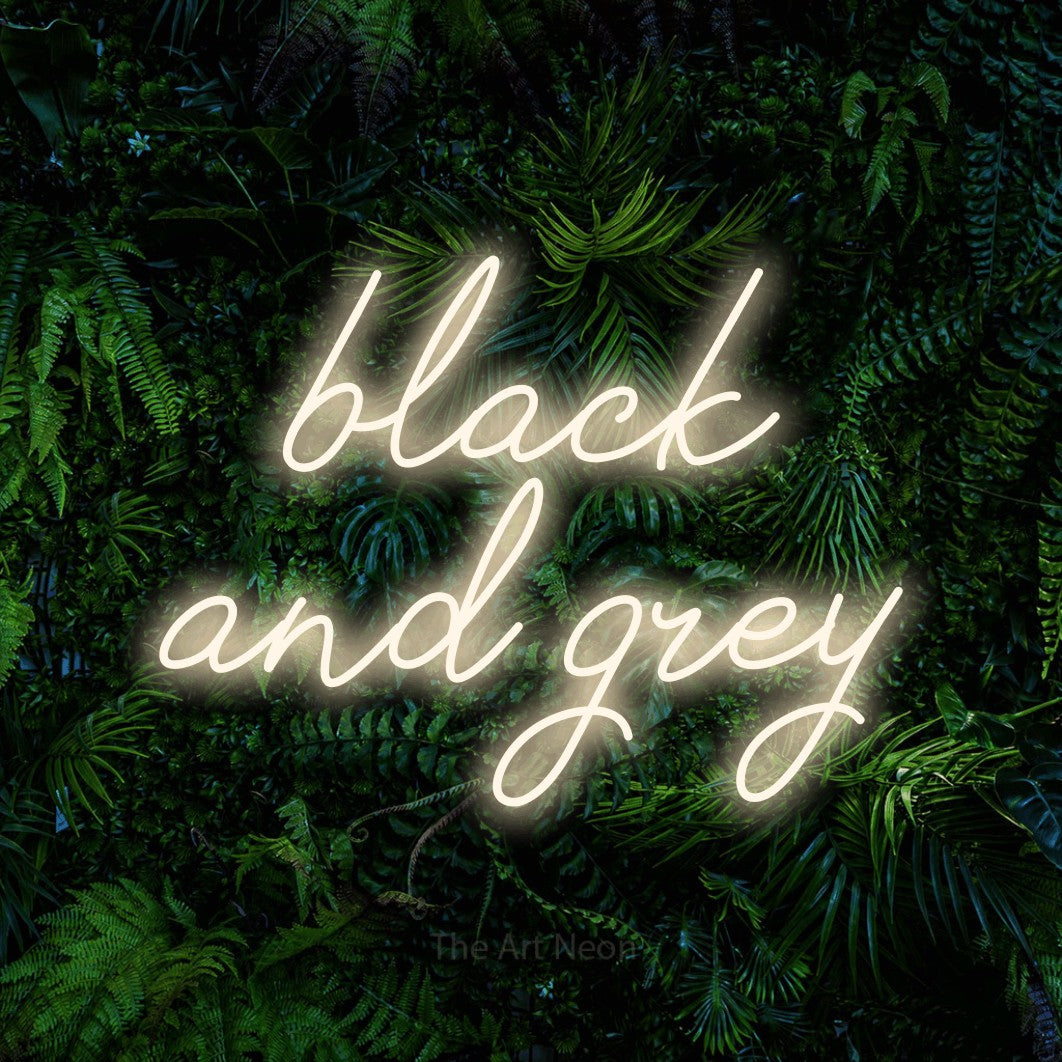 LED neon sign reading “black and grey”, arranged in two lines.