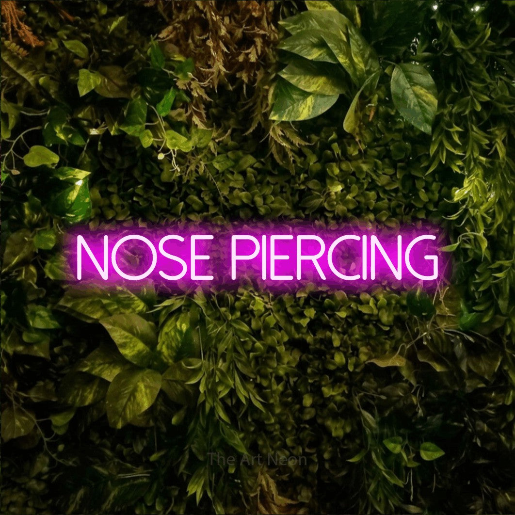 LED neon sign reading “Nose piercing”, arranged in a single line.