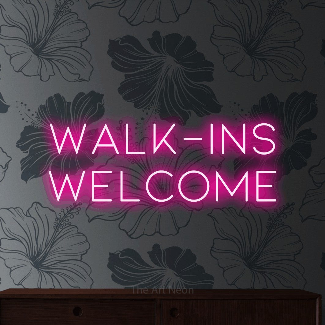 LED neon sign reading “Walk-ins Welcome”, arranged in two lines.