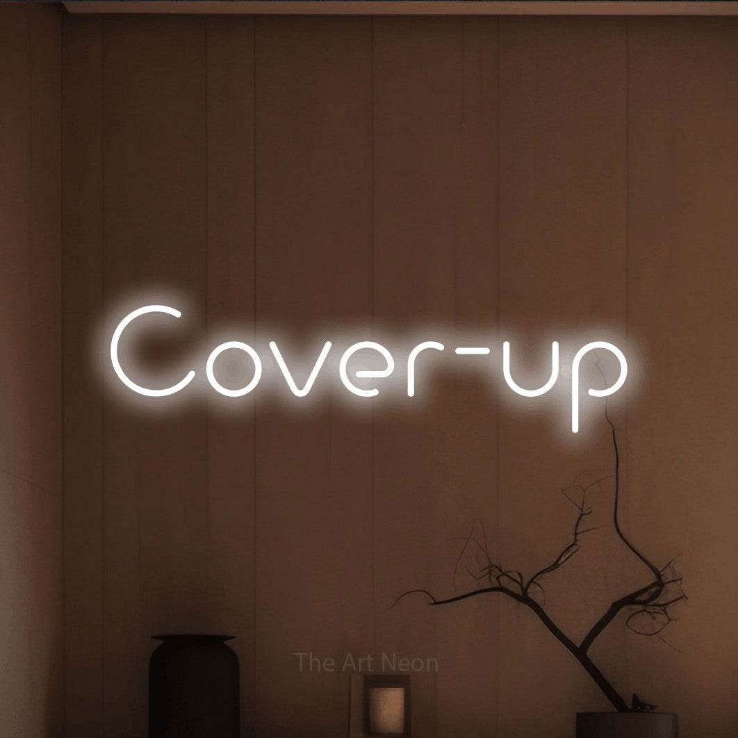 LED neon sign reading “Cover-up”, arranged in a single line.