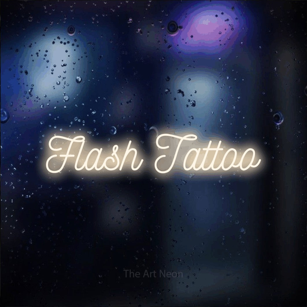 LED neon sign reading “Flash Tattoo”, arranged in a single line.