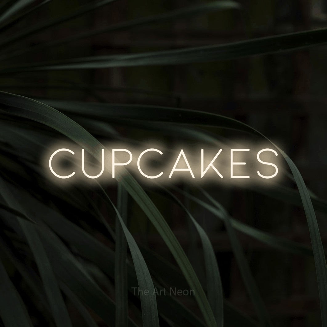 LED neon sign reading “Cupcakes”, arranged in a single line.
