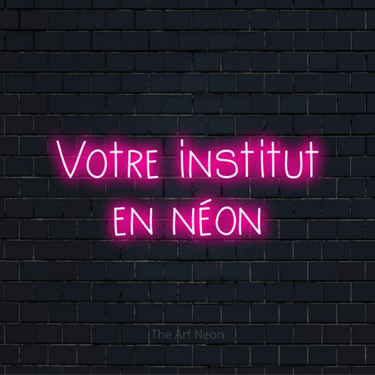 Enseigne néon personnalisée « Votre institut en néon » sur un mur en briques noires