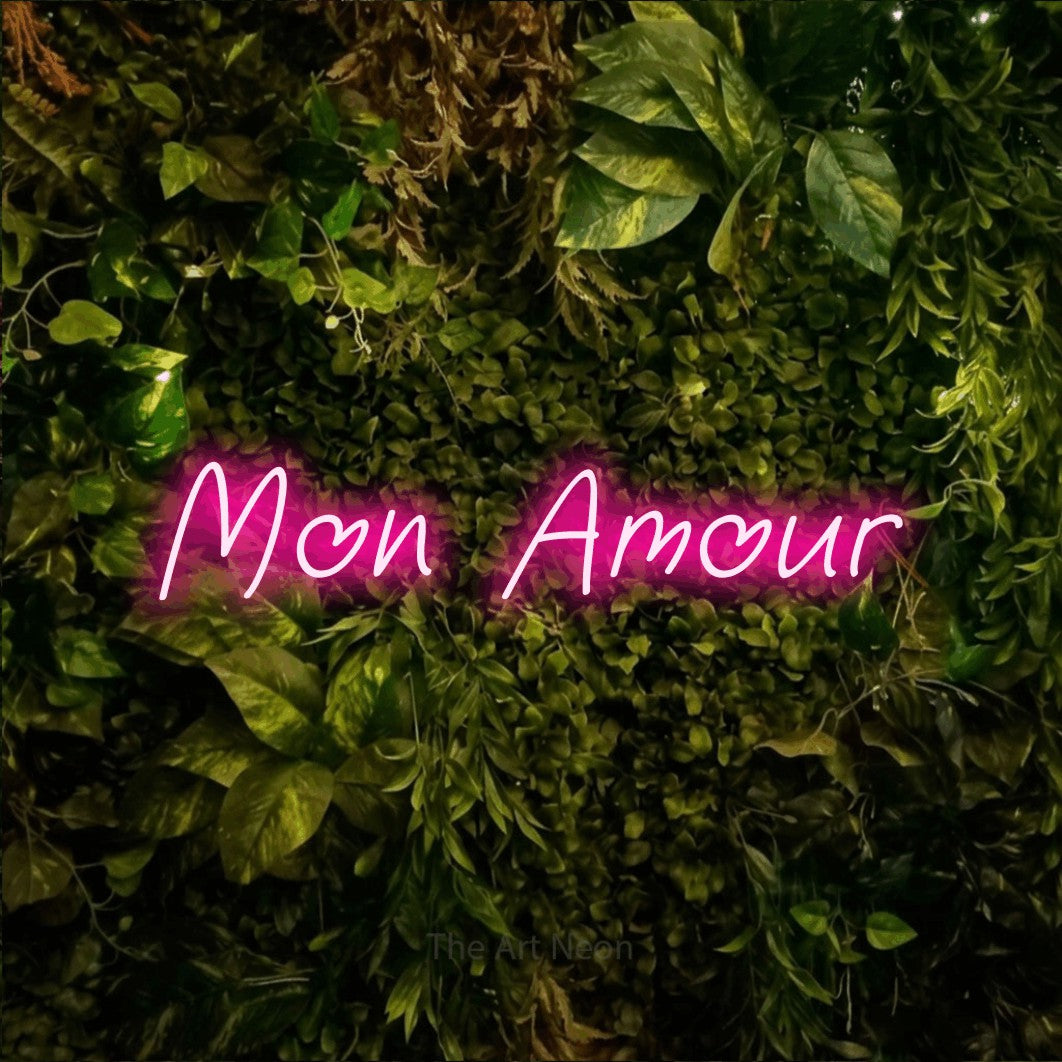 LED neon sign reading “Mon Amour”, arranged in a single line.