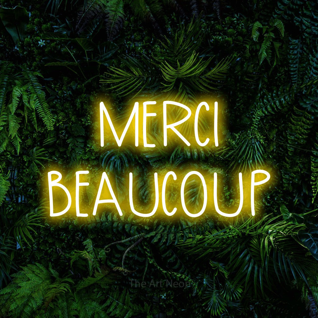 LED neon sign reading “MERCI BEAUCOUP”, arranged in 2 lines.