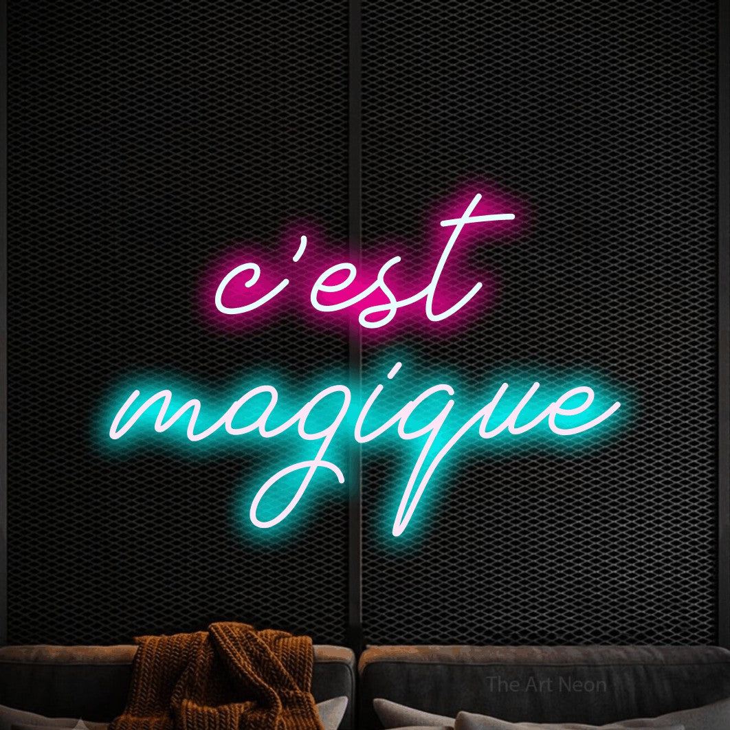 LED neon sign reading “c'est magique”, arranged in 2 lines.
