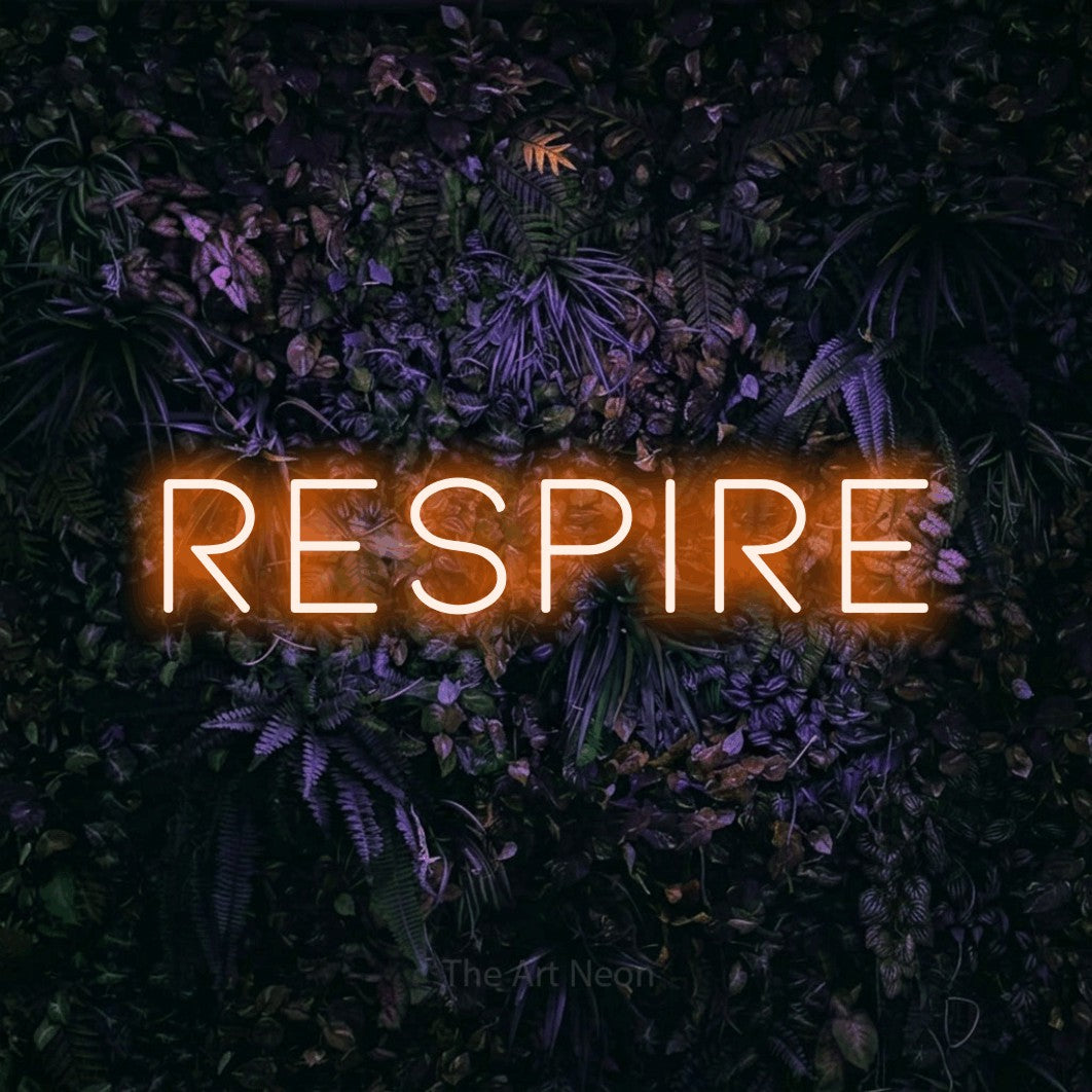 LED neon sign reading “respire”, arranged in a single line.
