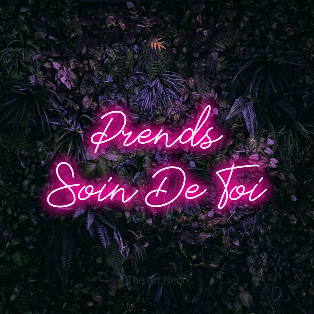 LED neon sign reading “Prends Soin De Toi”, arranged in 2 lines.