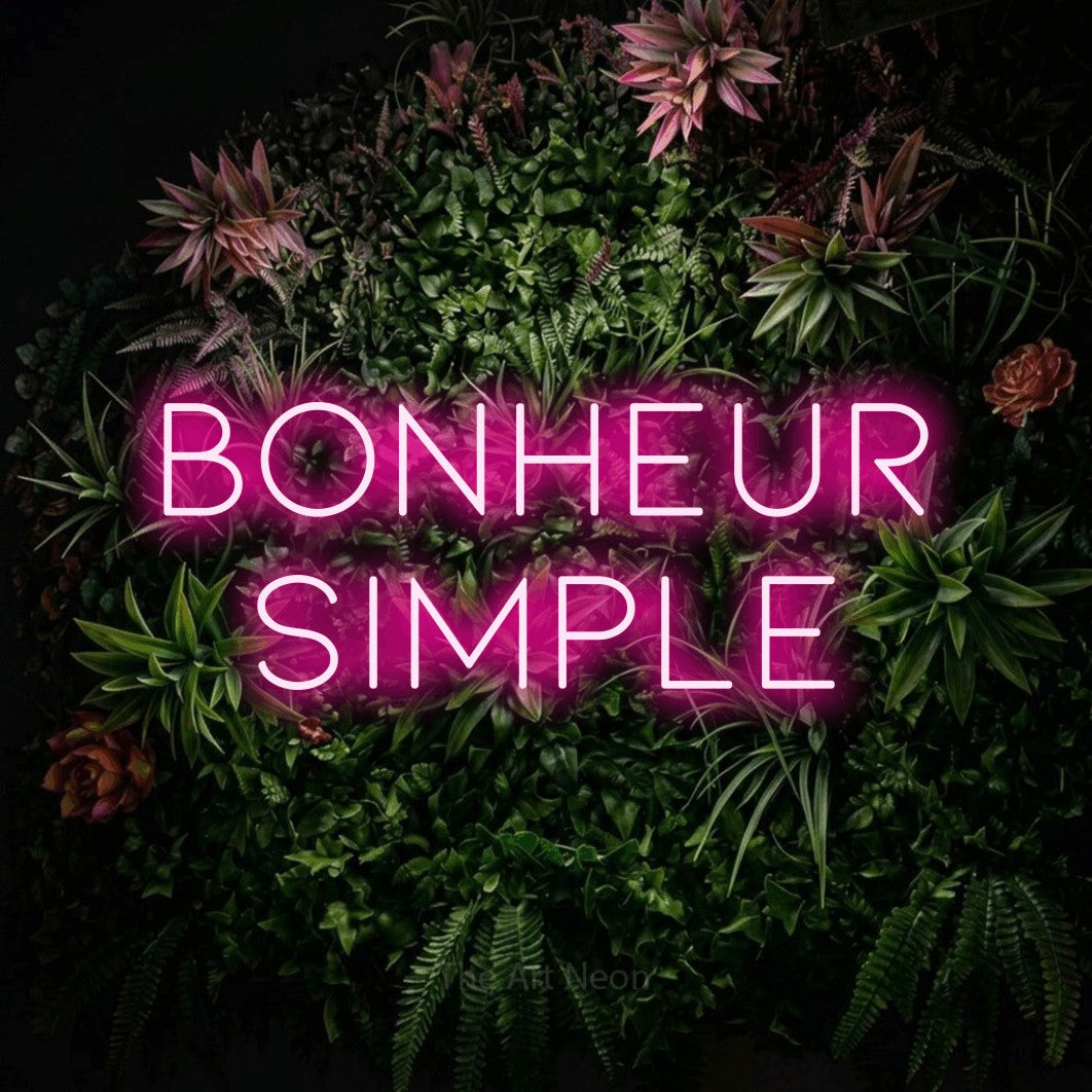 LED neon sign reading “bonheur simple”, arranged in 2 lines.