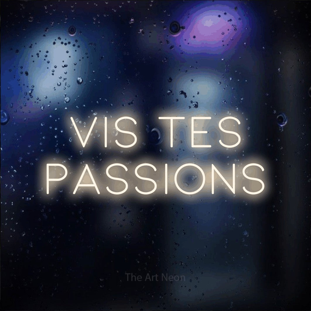 LED neon sign reading “VIS TES PASSIONS”, arranged in 2 lines.
