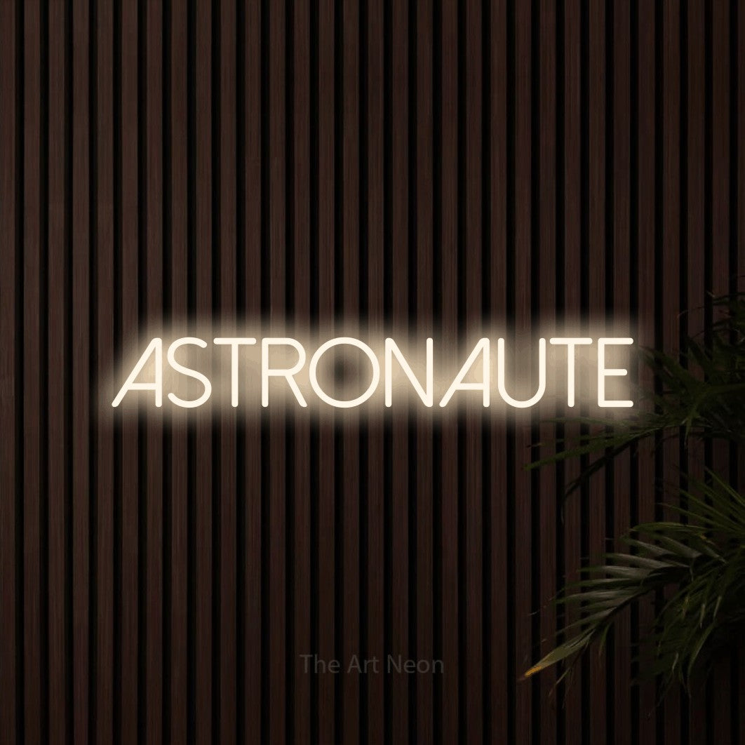 LED neon sign reading “ASTRONAUTE”, arranged in a single line.