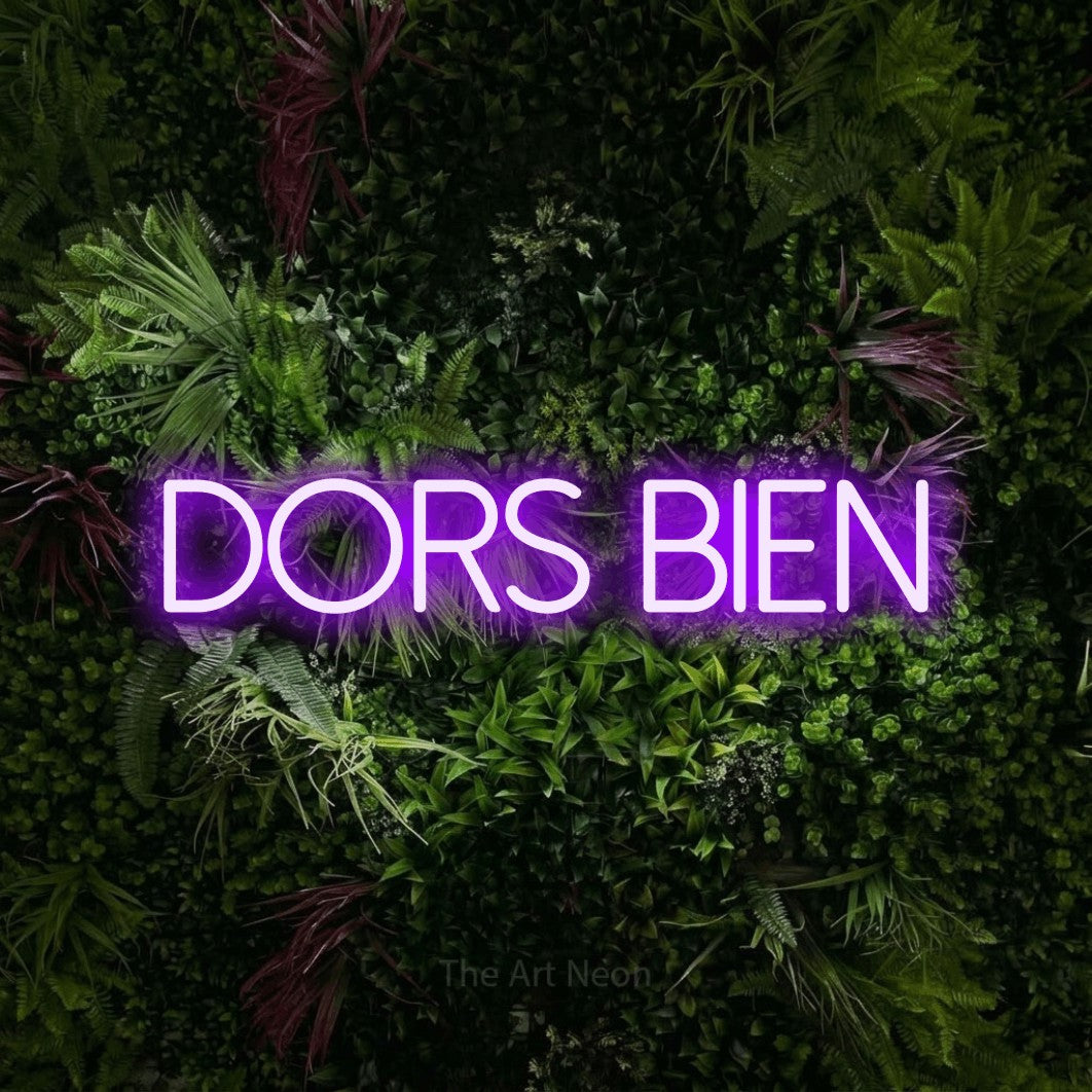 LED neon sign reading “DORS BIEN”, arranged in a single line.