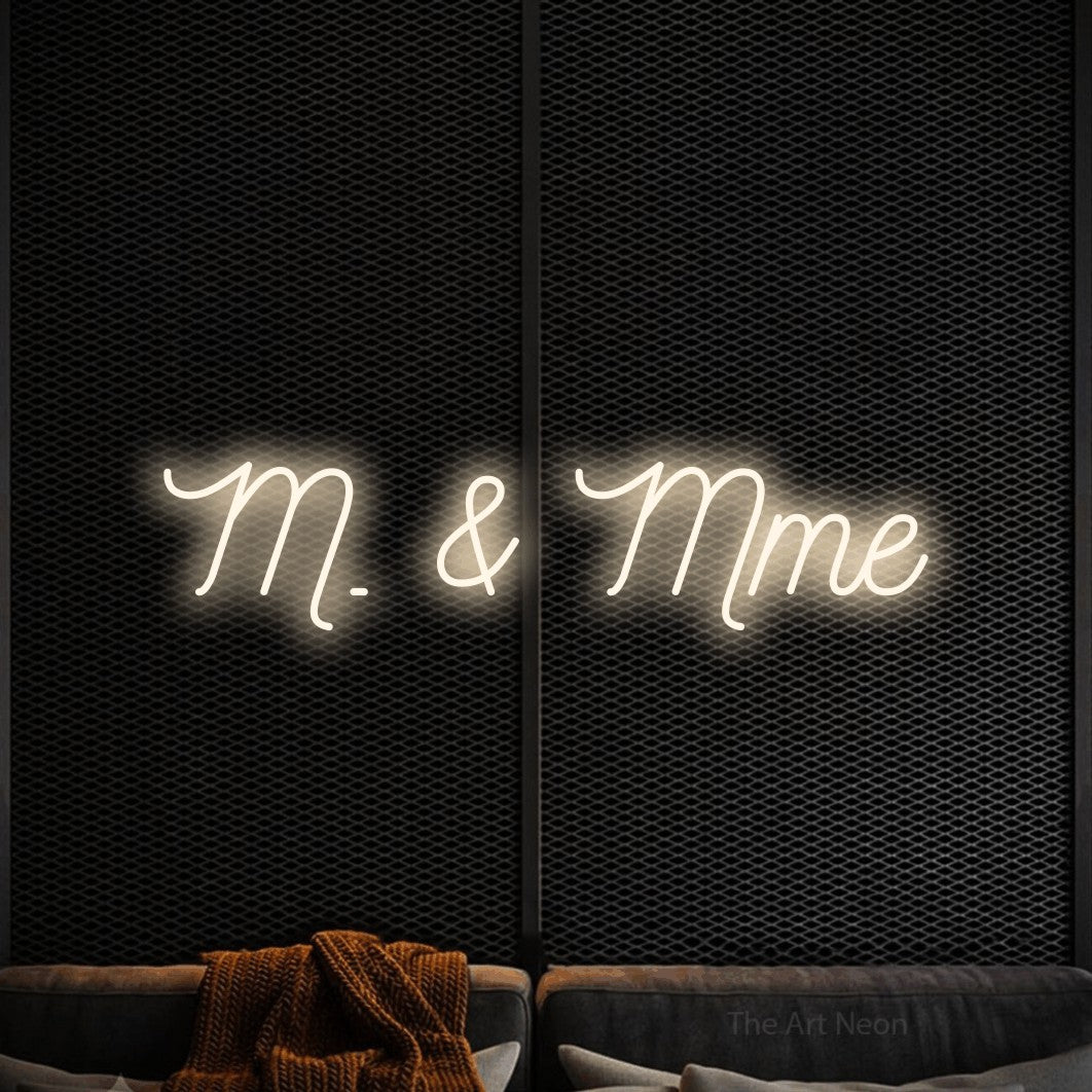 LED neon sign reading “M. & Mme”, arranged in a single line.