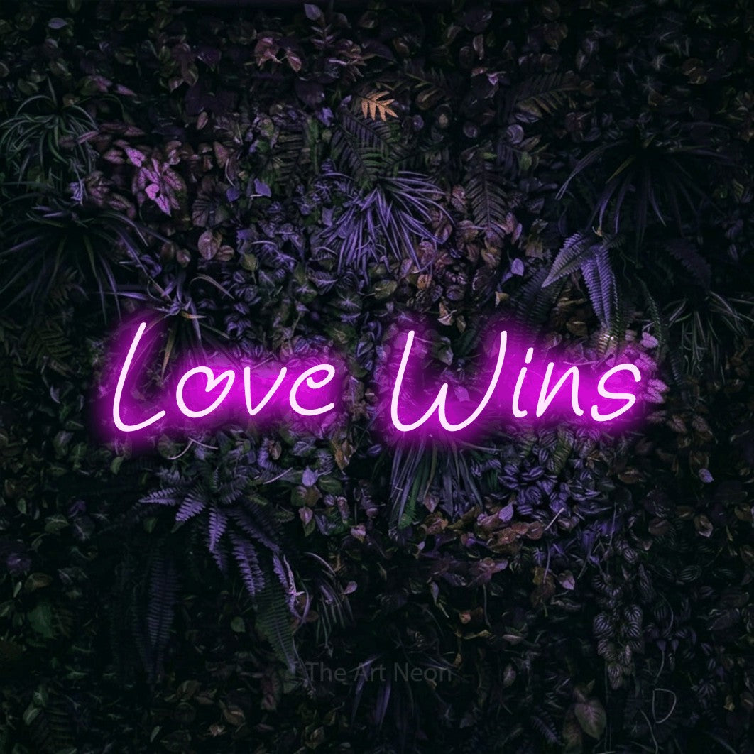 LED neon sign reading “Love Wins”, arranged in a single line.