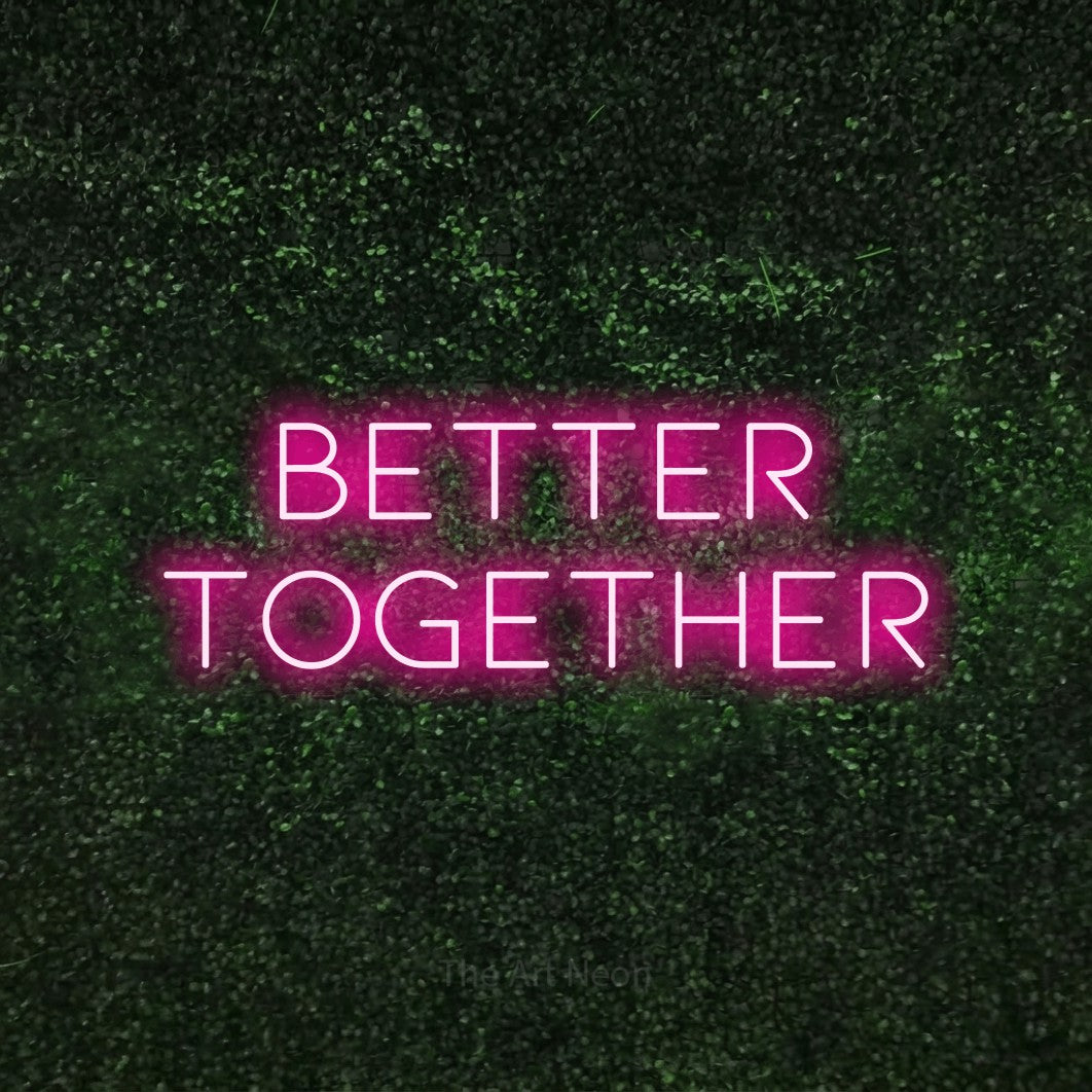 LED neon sign reading “better together”, arranged in 2 lines.