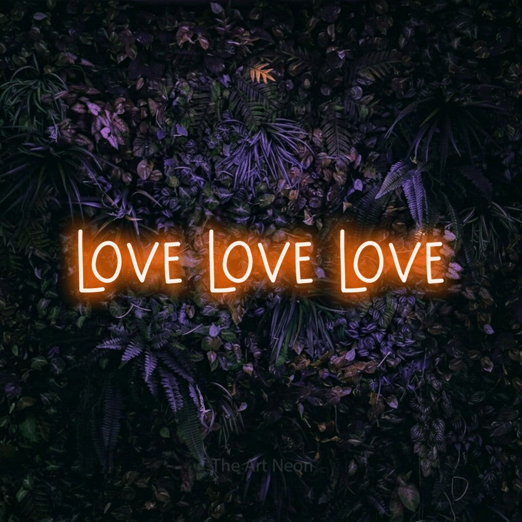 LED neon sign reading “love love love”, arranged in a single line.