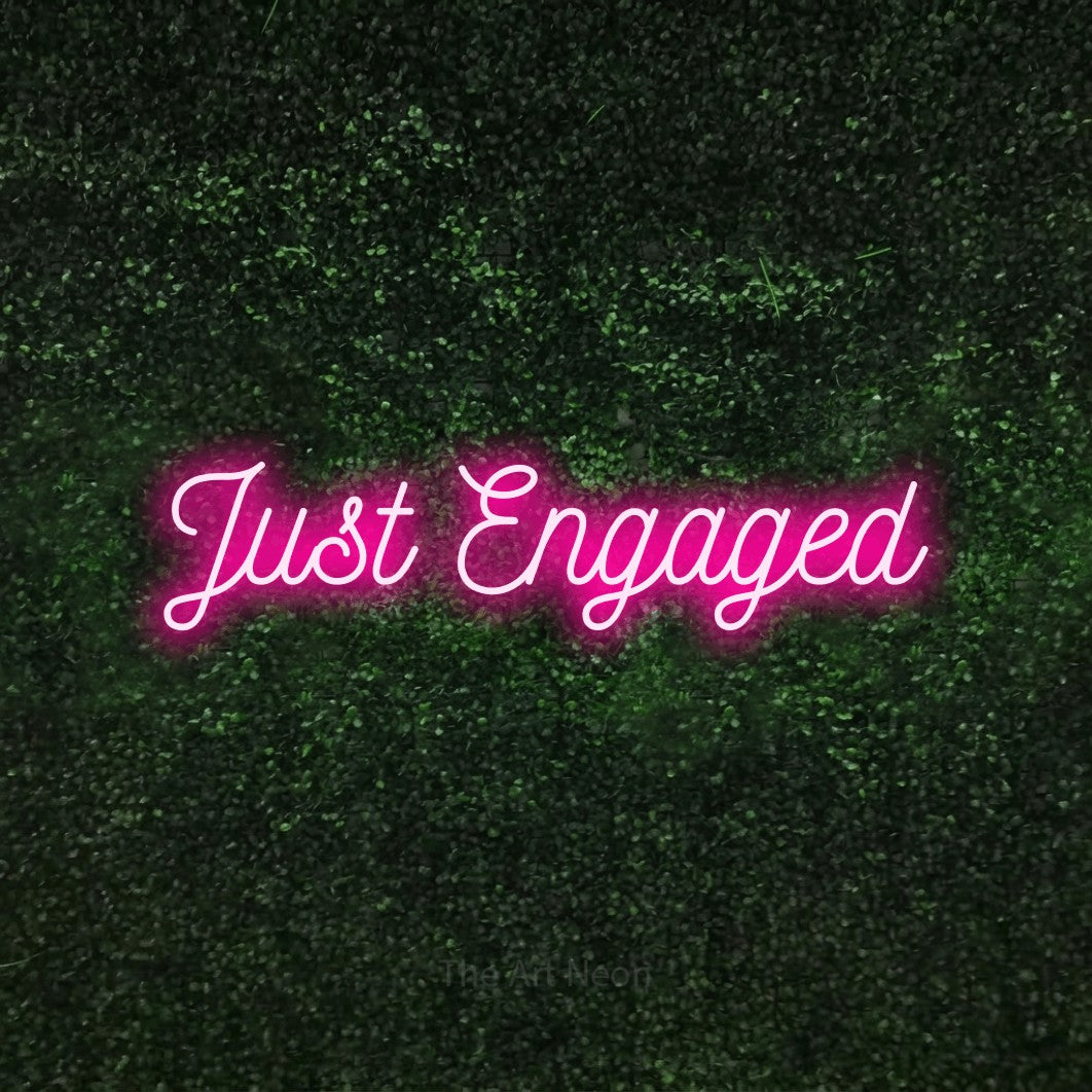 LED neon sign reading “Just Engaged”, arranged in a single line.