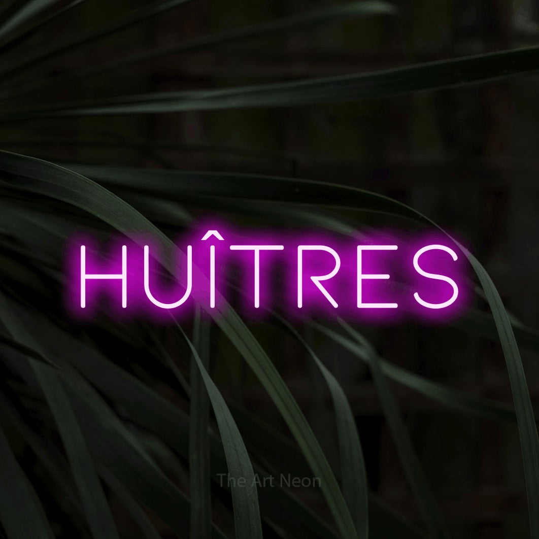 LED neon sign reading “HUÎTRES”, arranged in a single line.