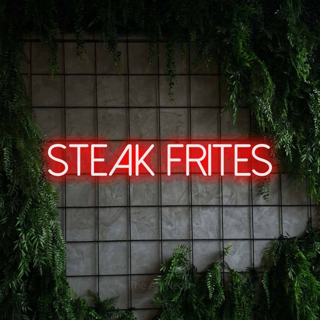 LED neon sign reading “STEAK FRITES”, arranged in a single line.