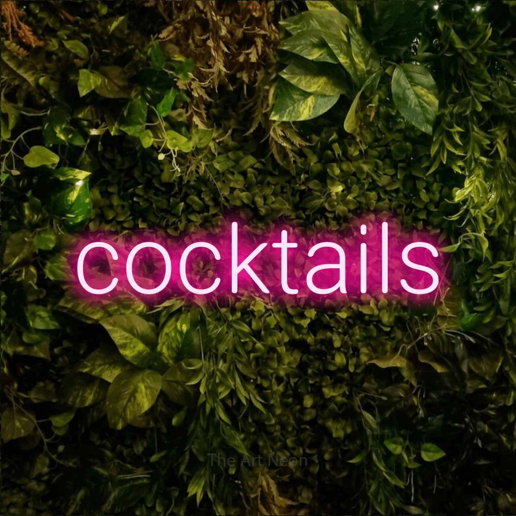 LED neon sign reading “cocktails”, arranged in a single line.