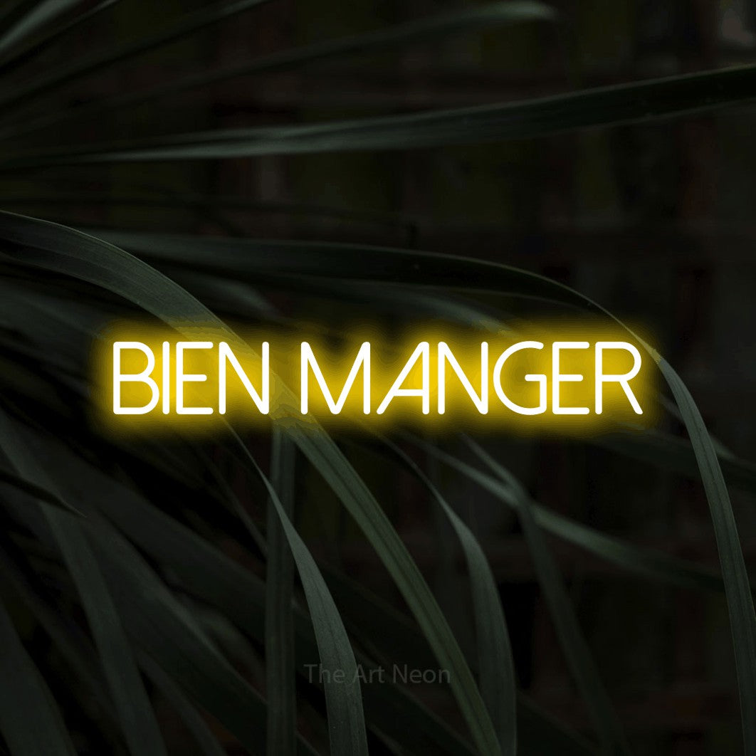 LED neon sign reading “bien MANGER”, arranged in a single line.