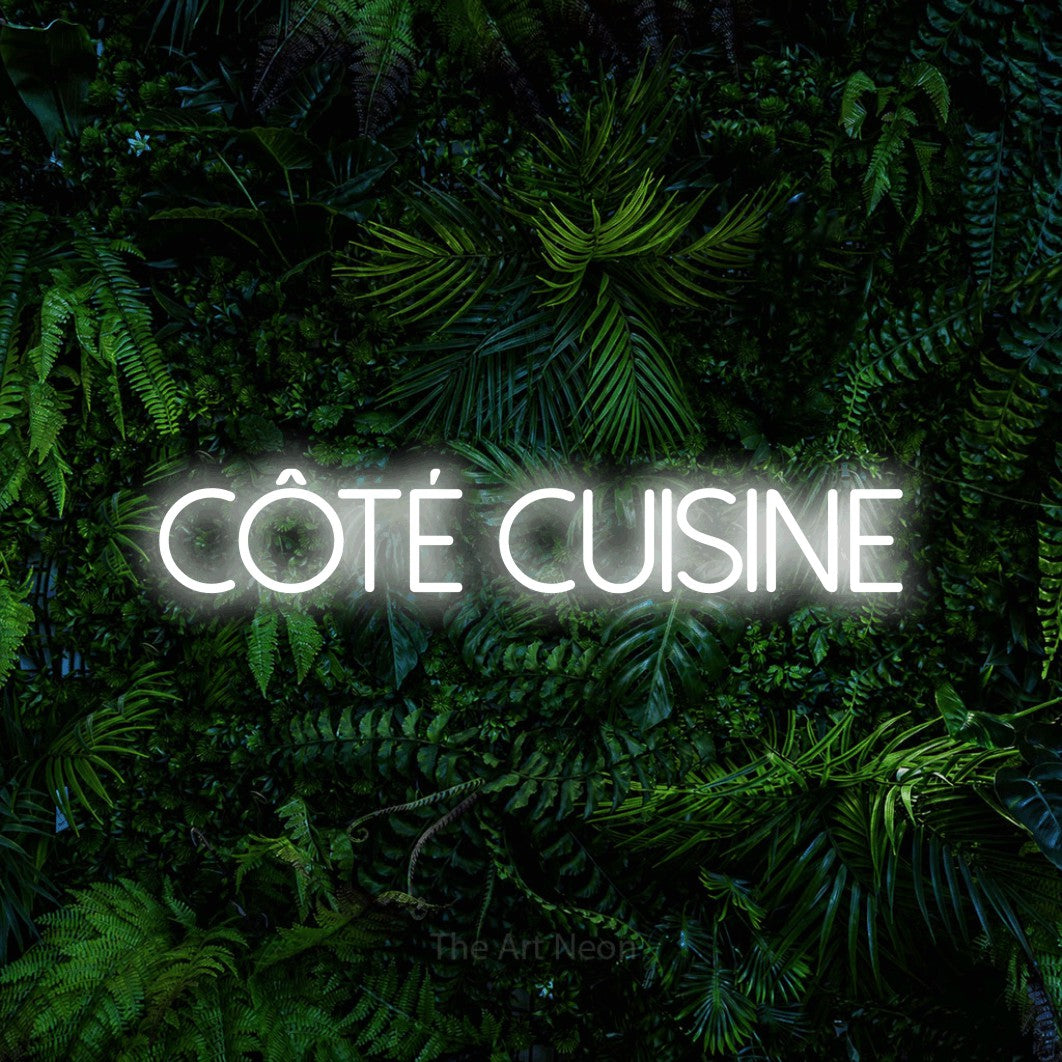LED neon sign reading “CÔTÉ CUISINE”, arranged in a single line.